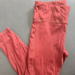 Vuori Stride leggings in brick